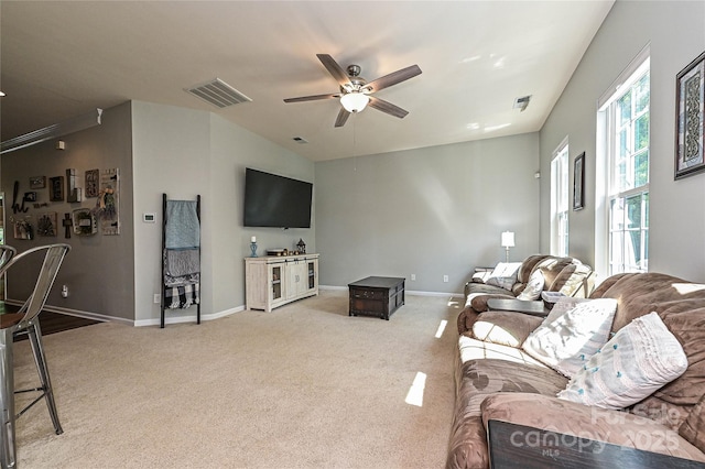 4018 Harmattan Dr, Denver, NC 28037 - living room featuring ceiling fan, light colored carpet, baseboards, and lofted ceiling