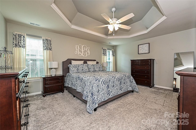 4018 Harmattan Dr, Denver, NC 28037 - carpeted bedroom featuring a raised ceiling, multiple windows, baseboards, a ceiling fan, and crown molding
