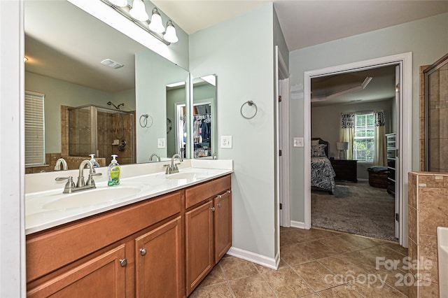 4018 Harmattan Dr, Denver, NC 28037 - full bathroom with ensuite bathroom, tile patterned flooring, double vanity, tiled shower, and a spacious closet