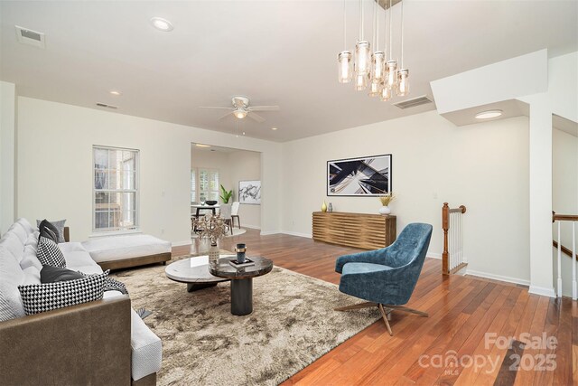 243 Lincoln St, Charlotte, NC 28203 - living area featuring wood finished floors, a ceiling fan, baseboards, and recessed lighting