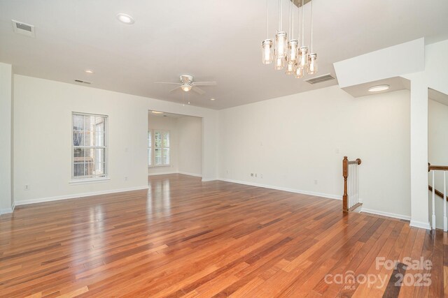 243 Lincoln St, Charlotte, NC 28203 - unfurnished living room featuring wood finished floors, ceiling fan, baseboards, and recessed lighting