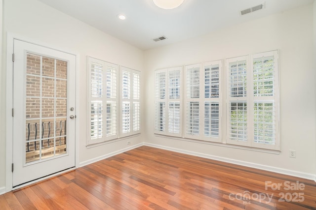 243 Lincoln St, Charlotte, NC 28203 - empty room featuring wood finished floors, baseboards, and recessed lighting