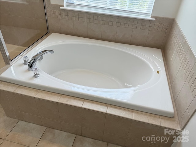 243 Lincoln St, Charlotte, NC 28203 - full bathroom with healthy amount of natural light, a bath, and tile patterned floors