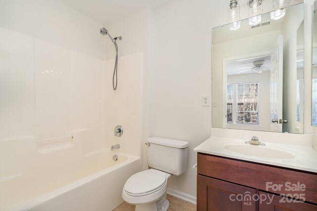 243 Lincoln St, Charlotte, NC 28203 - bathroom with toilet, vanity, bathing tub / shower combination, and baseboards