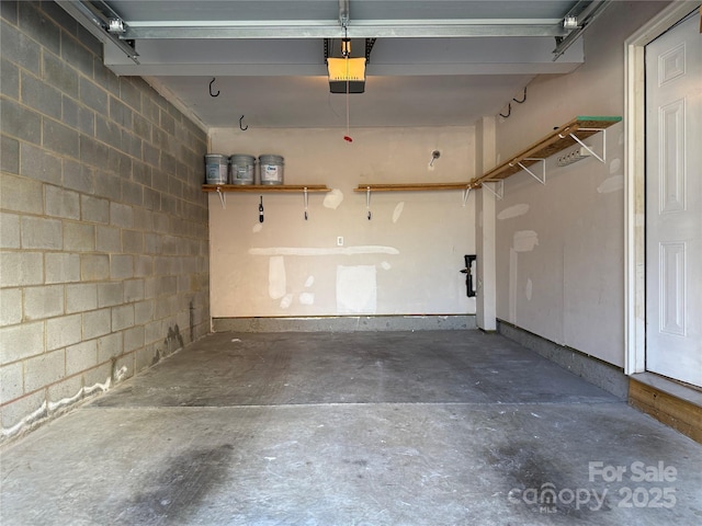 243 Lincoln St, Charlotte, NC 28203 - garage with concrete block wall and a garage door opener