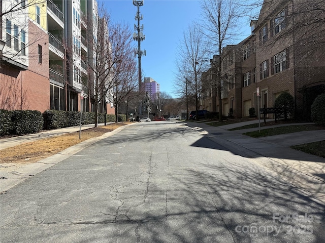 243 Lincoln St, Charlotte, NC 28203 - view of asphalt road featuring sidewalks and curbs