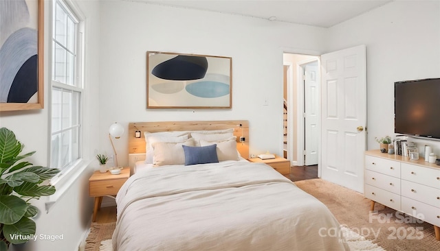 bedroom with wood finished floors