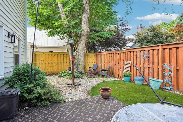 fenced backyard featuring a patio area