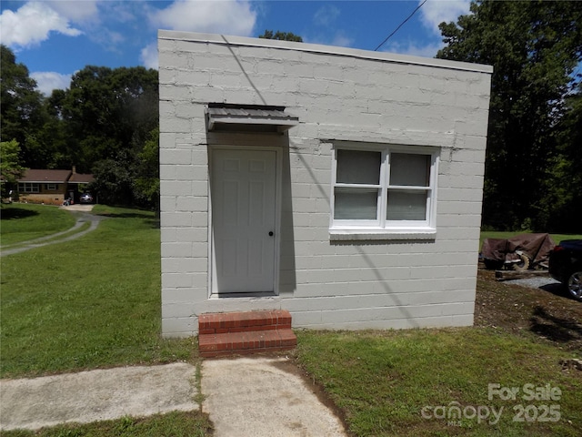 209 Barber Rd, Gastonia, NC 28056 - doorway to property featuring concrete block siding and a yard