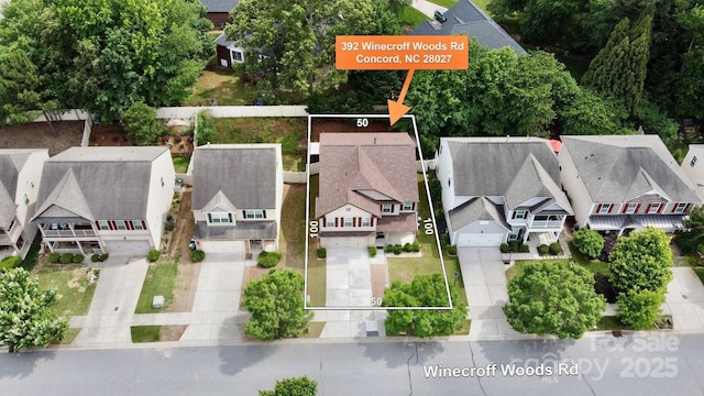 aerial view of residential area featuring property boundaries highlighted