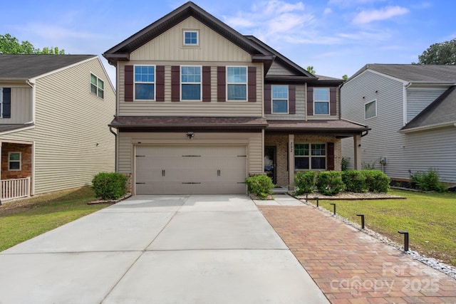view of front facade with a garage, concrete driveway, a front yard, brick siding, and covered porch
