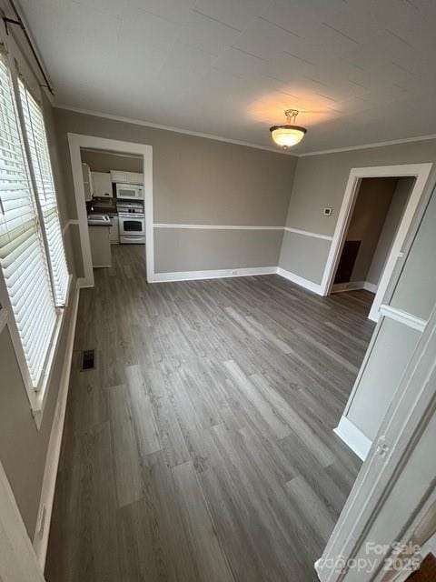 103 Duke St, Great Falls, SC 29055 - unfurnished room featuring ornamental molding, dark wood-type flooring, and baseboards