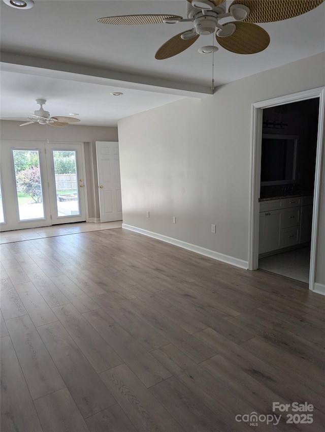 715 Gentry Pl, Charlotte, NC 28210 - unfurnished living room featuring ceiling fan and dark wood-style flooring
