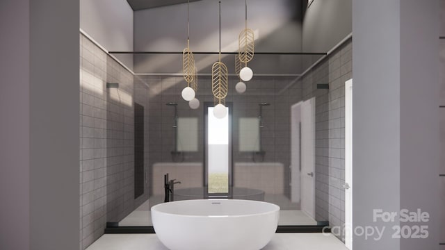 bathroom with a shower stall, a freestanding bath, and tile walls