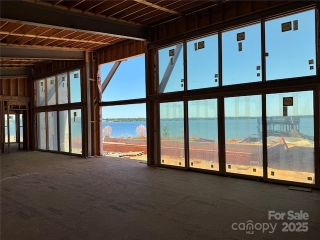 misc room featuring a water view