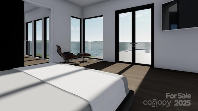bedroom featuring a water view, light wood-style flooring, and french doors