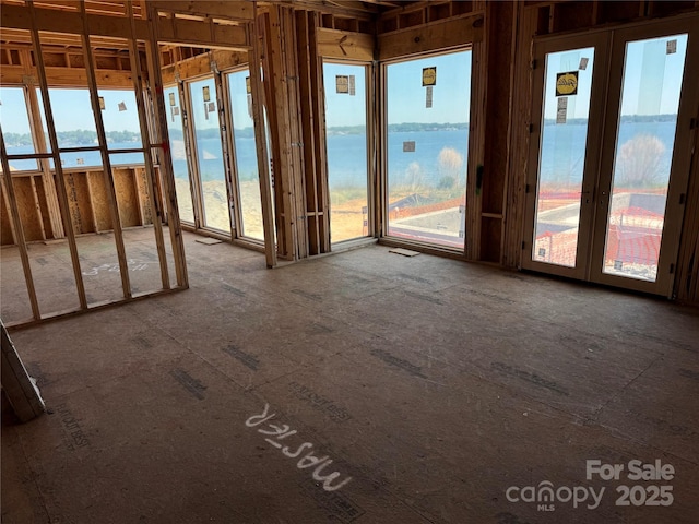 unfurnished sunroom with french doors