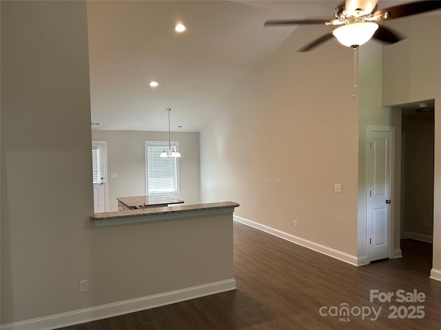 unfurnished living room with dark wood-style floors, baseboards, ceiling fan, and recessed lighting