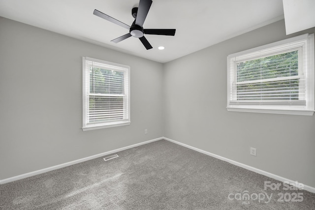 8514 Timber Crest Cir, Charlotte, NC 28226 - empty room with plenty of natural light, a ceiling fan, baseboards, carpet floors, and recessed lighting