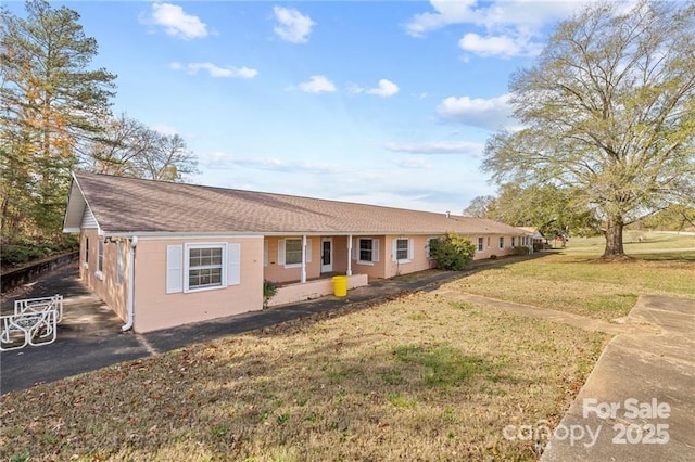 324 Horn Bottom Rd, Forest City, NC 28043 - ranch-style home featuring a front lawn, concrete block siding, and roof with shingles