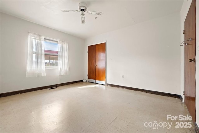 324 Horn Bottom Rd, Forest City, NC 28043 - unfurnished room with tile patterned floors, baseboards, and ceiling fan