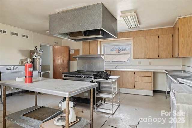 324 Horn Bottom Rd, Forest City, NC 28043 - kitchen featuring custom range hood, finished concrete flooring, range with two ovens, and light countertops