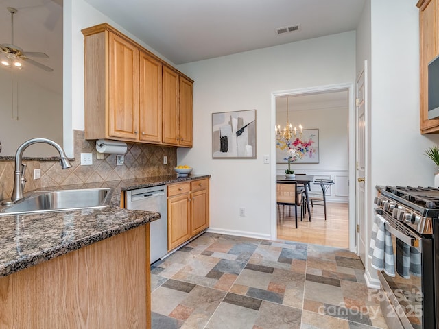 3066 Orion Dr, Fort Mill, SC 29707 - kitchen featuring a sink, stainless steel appliances, ceiling fan, backsplash, and a chandelier