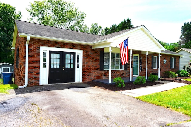1958 19th Avenue Dr NE Unit 8, Hickory, NC 28601 - ranch-style home featuring brick siding, french doors, a porch, and roof with shingles