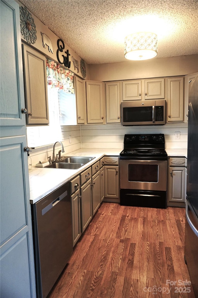 1958 19th Avenue Dr NE Unit 8, Hickory, NC 28601 - kitchen featuring stainless steel appliances, a sink, gray cabinetry, light countertops, and a textured ceiling