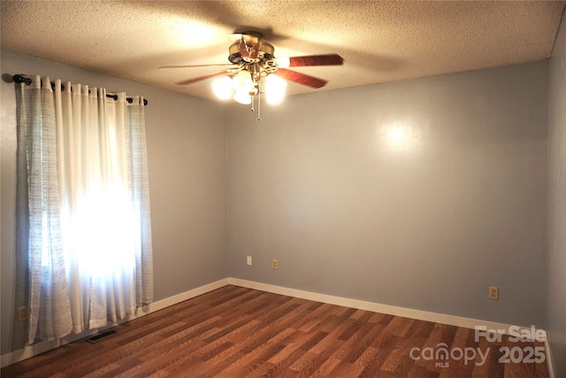 1958 19th Avenue Dr NE Unit 8, Hickory, NC 28601 - spare room featuring ceiling fan, dark wood finished floors, baseboards, and a textured ceiling