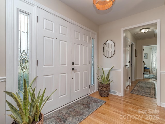 214 Wilcrest Dr, Matthews, NC 28105 - entryway featuring light wood finished floors and baseboards