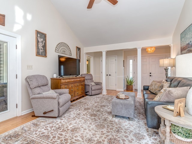 214 Wilcrest Dr, Matthews, NC 28105 - living room with ornate columns, ceiling fan, baseboards, wood finished floors, and high vaulted ceiling