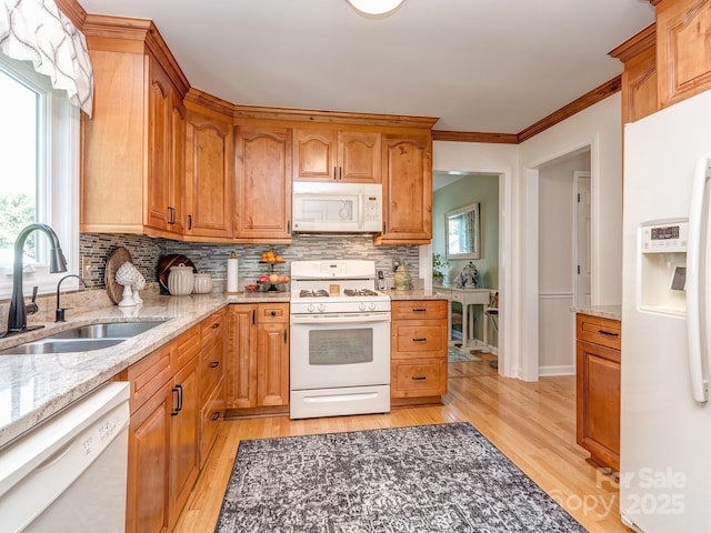 214 Wilcrest Dr, Matthews, NC 28105 - kitchen with white appliances, a sink, light wood-style flooring, backsplash, and crown molding