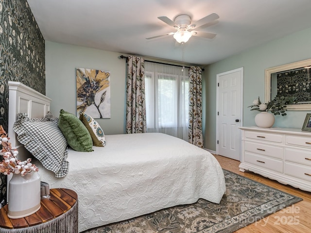 214 Wilcrest Dr, Matthews, NC 28105 - bedroom with a ceiling fan and light wood-style floors