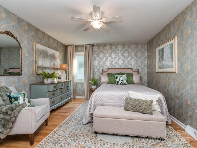 214 Wilcrest Dr, Matthews, NC 28105 - bedroom with wallpapered walls, wood finished floors, ceiling fan, and baseboards