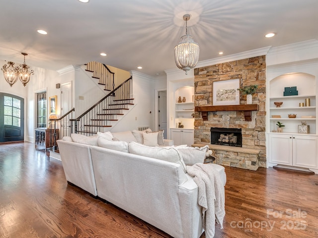 1404 Lookout Cir, Waxhaw, NC 28173 - living area with a chandelier, crown molding, stairs, dark wood-style floors, and recessed lighting
