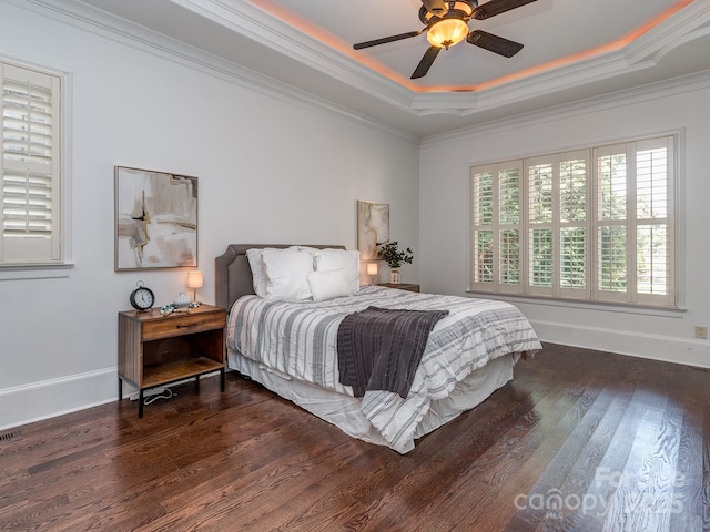 1404 Lookout Cir, Waxhaw, NC 28173 - bedroom featuring a raised ceiling, wood finished floors, crown molding, and ceiling fan