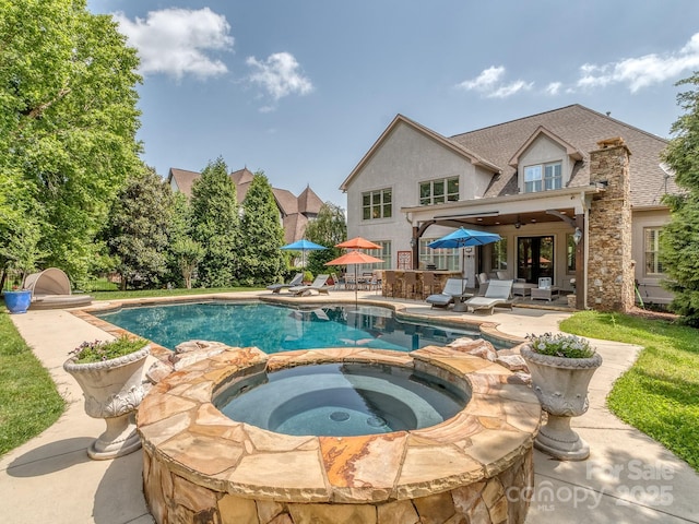 1404 Lookout Cir, Waxhaw, NC 28173 - view of swimming pool with a patio, a pool with connected hot tub, and a ceiling fan
