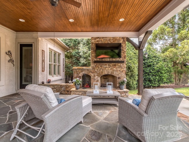 1404 Lookout Cir, Waxhaw, NC 28173 - view of patio with ceiling fan and an outdoor living space with a fireplace