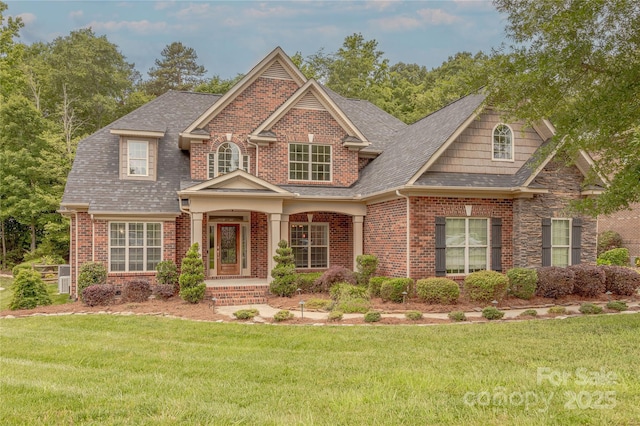 4113 Hoffmeister Dr, Waxhaw, NC 28173 - craftsman inspired home featuring a front lawn, brick siding, and a shingled roof