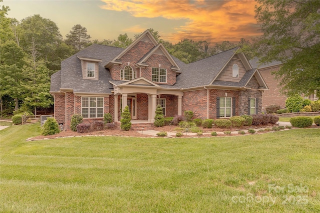 4113 Hoffmeister Dr, Waxhaw, NC 28173 - view of front of house featuring brick siding, a front lawn, and roof with shingles