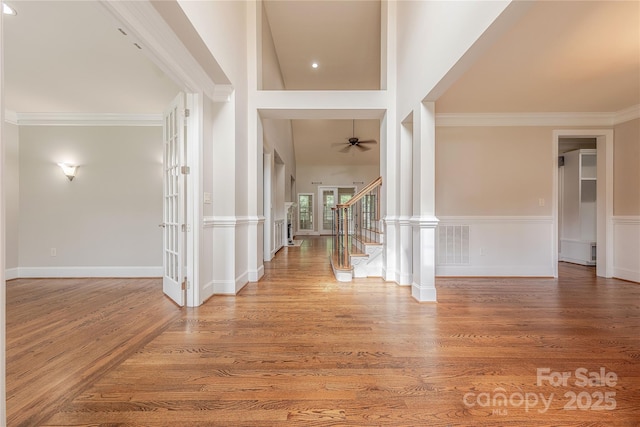 4113 Hoffmeister Dr, Waxhaw, NC 28173 - foyer featuring wood finished floors, stairway, ornamental molding, and a ceiling fan