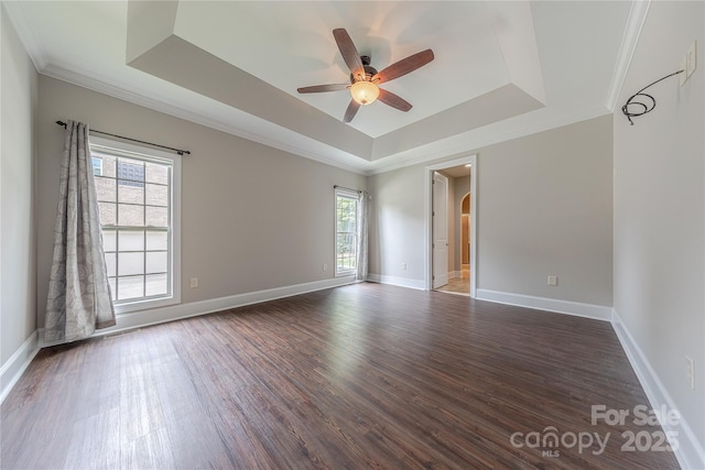 4113 Hoffmeister Dr, Waxhaw, NC 28173 - empty room featuring a raised ceiling, healthy amount of natural light, ceiling fan, wood finished floors, and crown molding