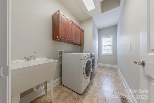4113 Hoffmeister Dr, Waxhaw, NC 28173 - laundry area with cabinet space, baseboards, washing machine and dryer, and light tile patterned floors