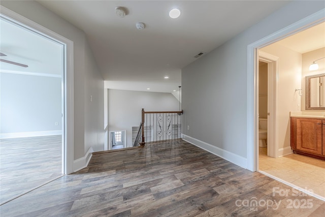 4113 Hoffmeister Dr, Waxhaw, NC 28173 - corridor with an upstairs landing, wood finished floors, recessed lighting, and baseboards