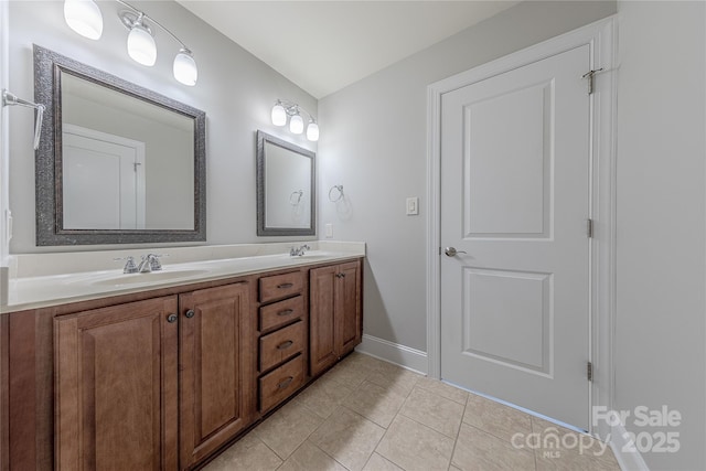 4113 Hoffmeister Dr, Waxhaw, NC 28173 - bathroom with tile patterned floors, double vanity, and baseboards