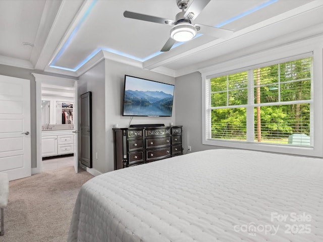 bedroom featuring light colored carpet and a ceiling fan