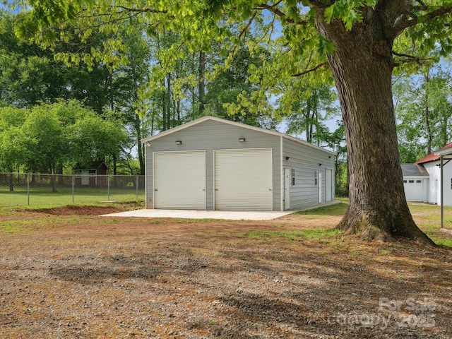 detached garage with fence