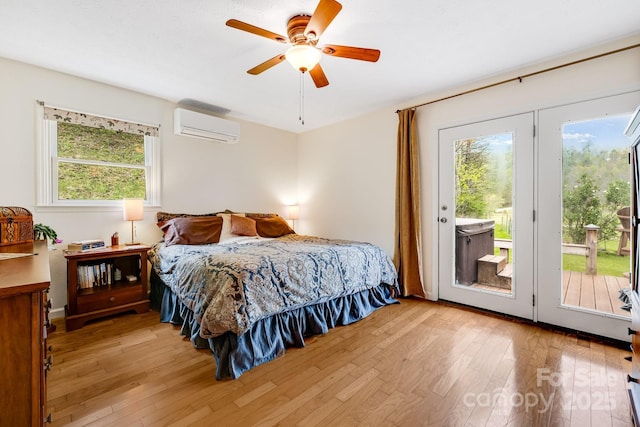 6334 Jacks Creek Rd, Burnsville, NC 28714 - bedroom featuring a wall unit AC, access to outside, light wood-style flooring, and ceiling fan