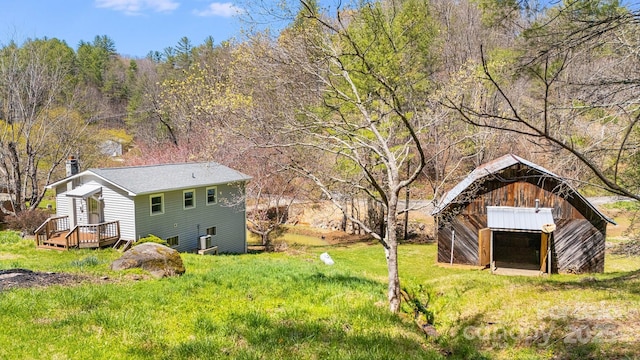 6334 Jacks Creek Rd, Burnsville, NC 28714 - view of yard featuring an outdoor structure and a forest view
